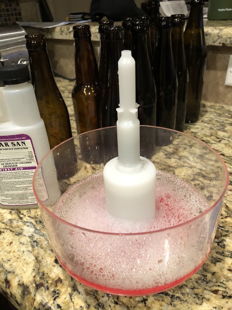 Bottle rinser with sanitizer solution prepared