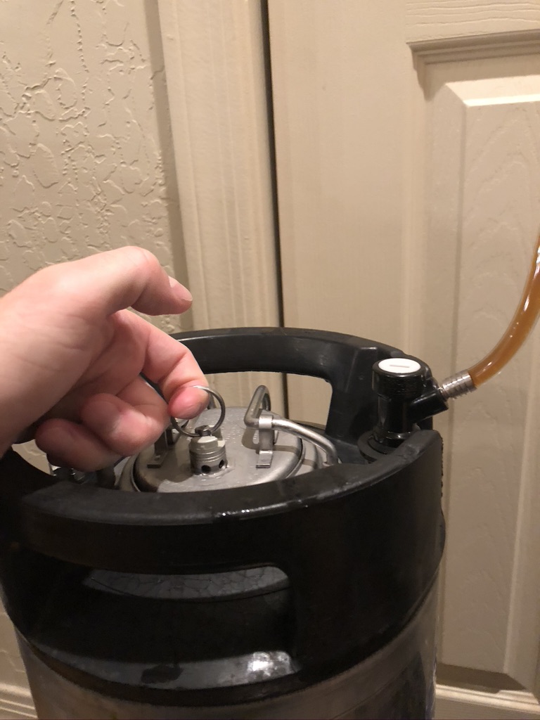 Decreasing pressure in serving keg, allowing more beer to fill it