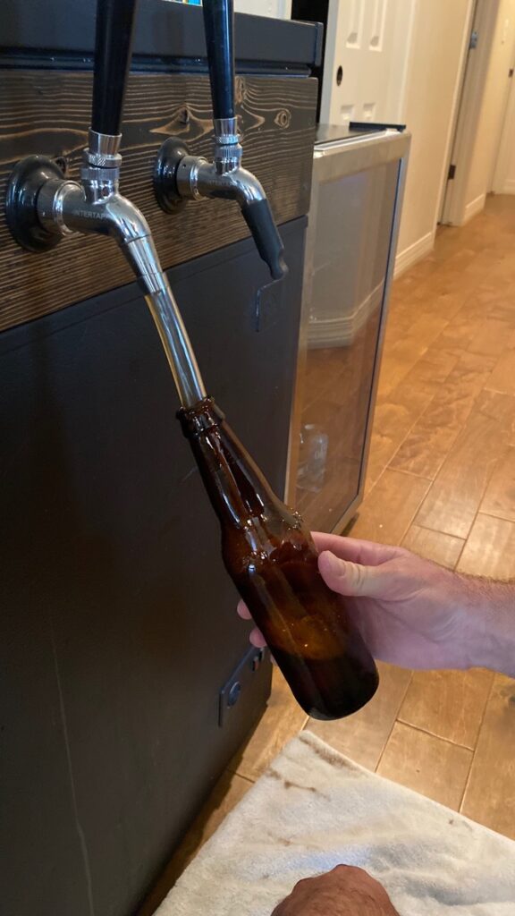 Filling the bottle with beer