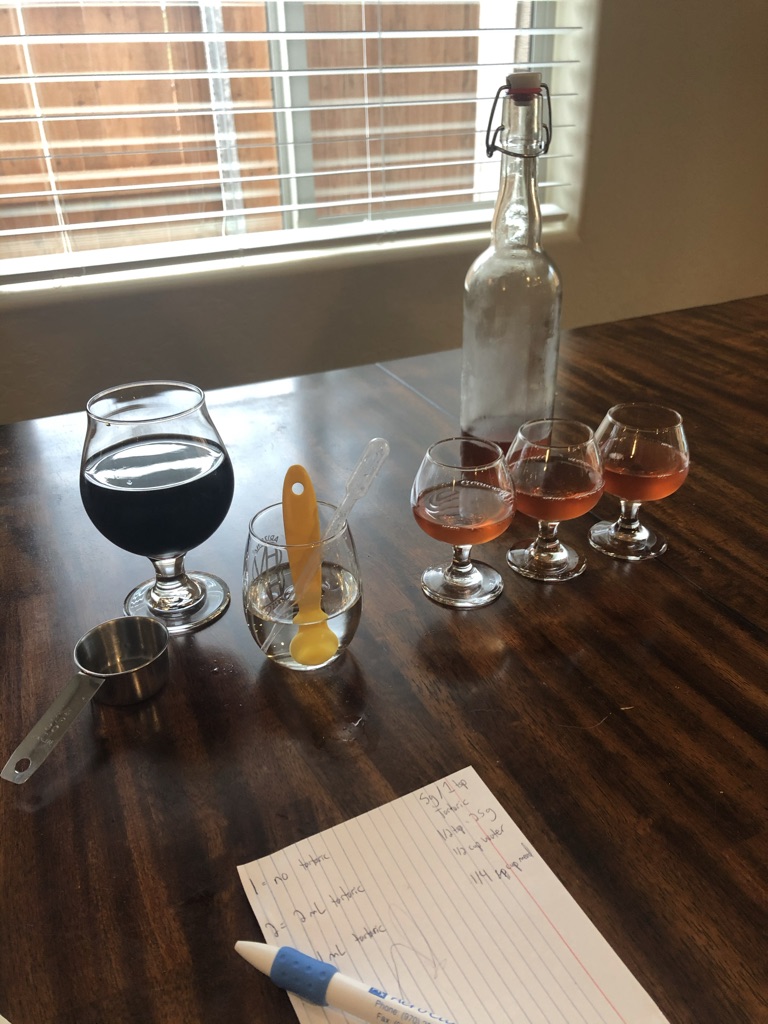 Tasting different amounts of tartaric acid to a cranberry spiced mead, I did not have an image of performing this with cider available 