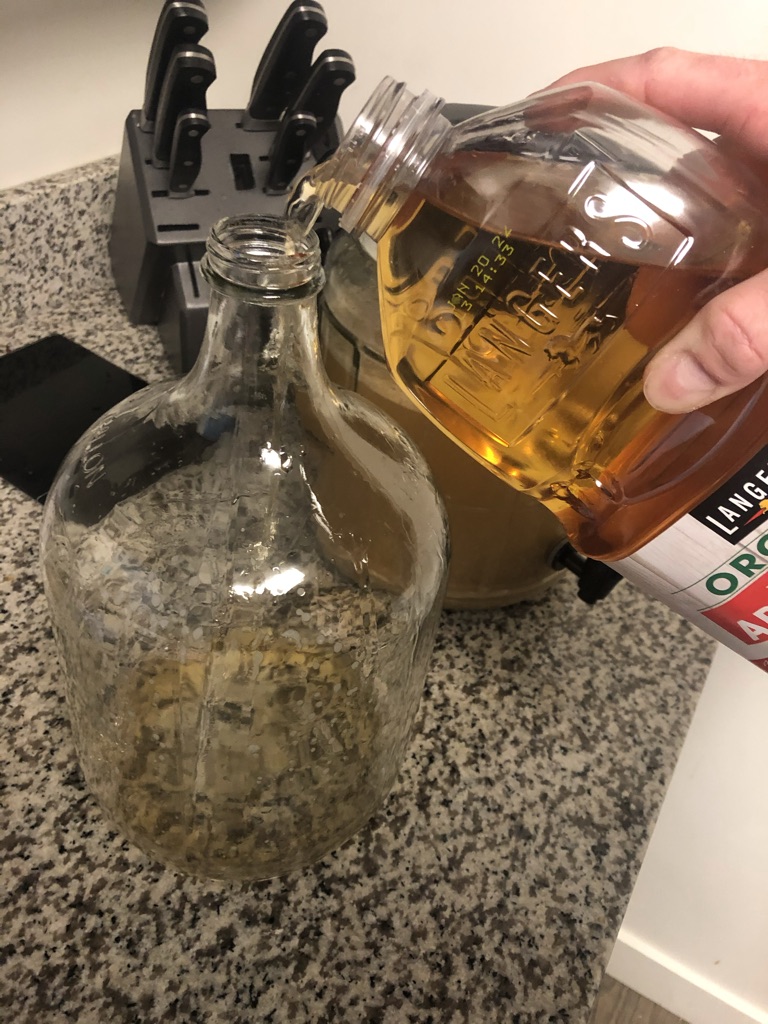 Pouring apple juice into fermentor